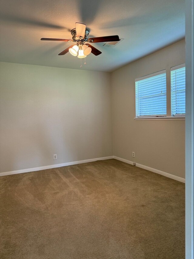 8615 Washington Blvd, Beaumont, TX 77707 - spare room with a ceiling fan, carpet floors, and baseboards