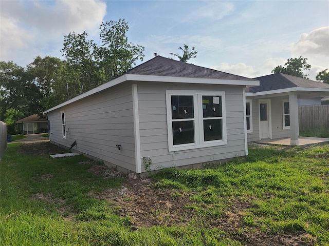 1617 14th Ave N, Texas City, TX 77590 - rear view of house featuring a patio and a shingled roof