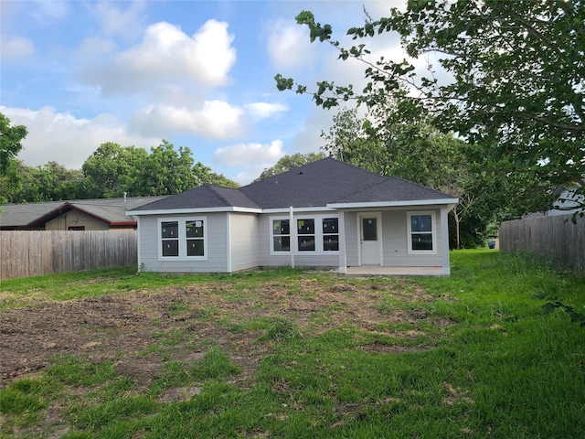 1617 14th Ave N, Texas City, TX 77590 - back of house featuring fence and a patio