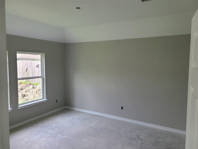 1617 14th Ave N, Texas City, TX 77590 - spare room featuring concrete flooring and vaulted ceiling