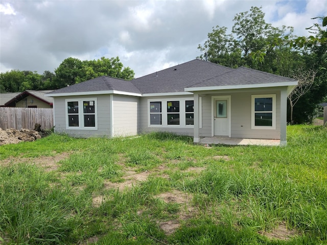 1617 14th Ave N, Texas City, TX 77590 - rear view of house with a patio area and roof with shingles