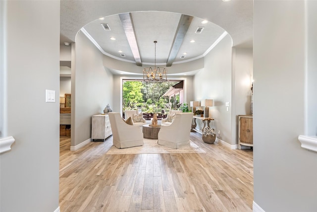 11 Turtle Cove Ct, Kingwood, TX 77346 - dining room featuring wood finished floors, baseboards, a chandelier, crown molding, and arched walkways
