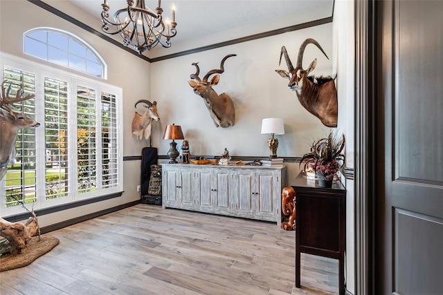 11 Turtle Cove Ct, Kingwood, TX 77346 - home office with a chandelier, light wood-style floors, baseboards, and crown molding