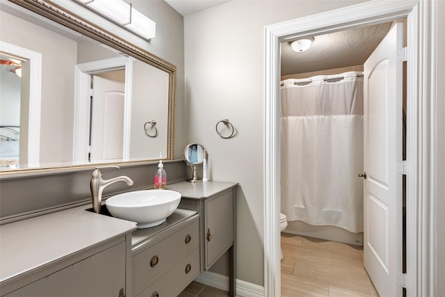 11 Turtle Cove Ct, Kingwood, TX 77346 - bathroom featuring vanity and toilet