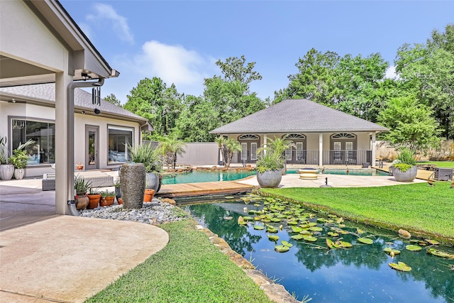 11 Turtle Cove Ct, Kingwood, TX 77346 - view of swimming pool with a patio