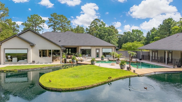 11 Turtle Cove Ct, Kingwood, TX 77346 - rear view of property featuring a patio area and stucco siding