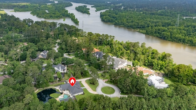 11 Turtle Cove Ct, Kingwood, TX 77346 - aerial view of property and surrounding area featuring a nearby body of water and a forest