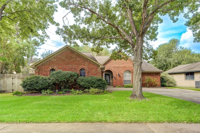 538 Everington Dr, Katy, TX 77450 - traditional-style house featuring brick siding, central AC unit, driveway, and a shingled roof