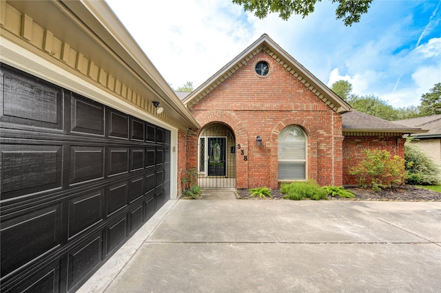 538 Everington Dr, Katy, TX 77450 - view of front facade with brick siding, driveway, and a shingled roof