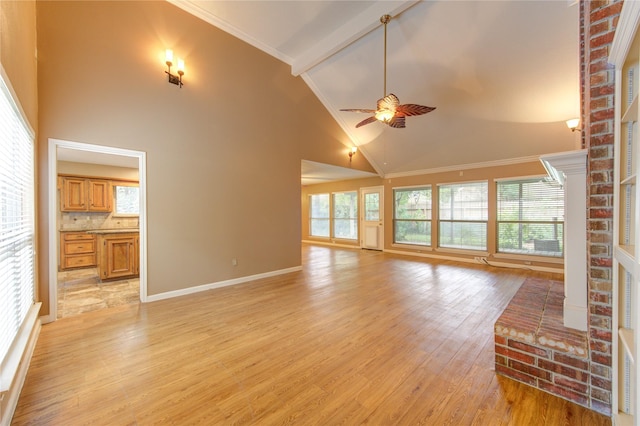 538 Everington Dr, Katy, TX 77450 - unfurnished living room with light wood finished floors, ceiling fan, crown molding, high vaulted ceiling, and baseboards