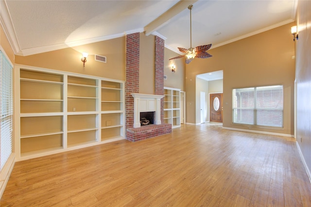 538 Everington Dr, Katy, TX 77450 - unfurnished living room featuring ornamental molding, light wood-type flooring, high vaulted ceiling, ceiling fan, and a fireplace