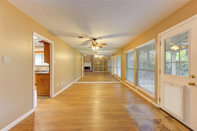 538 Everington Dr, Katy, TX 77450 - unfurnished sunroom with wood-type flooring and baseboards
