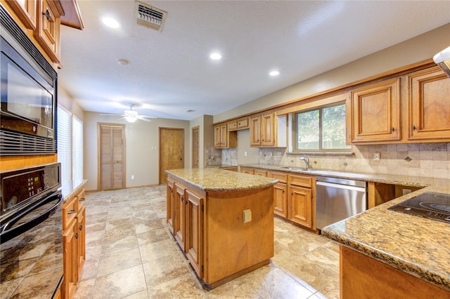 538 Everington Dr, Katy, TX 77450 - kitchen featuring black appliances, a sink, tasteful backsplash, light stone counters, and recessed lighting