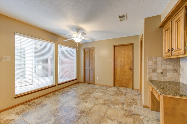 538 Everington Dr, Katy, TX 77450 - kitchen featuring a ceiling fan, backsplash, and baseboards