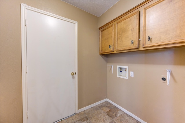 538 Everington Dr, Katy, TX 77450 - laundry room featuring cabinet space, hookup for a washing machine, hookup for an electric dryer, baseboards, and a textured ceiling