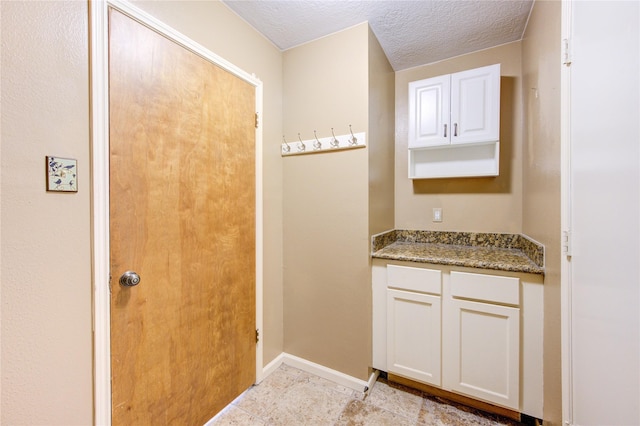 538 Everington Dr, Katy, TX 77450 - bathroom with baseboards, a textured ceiling, and vanity