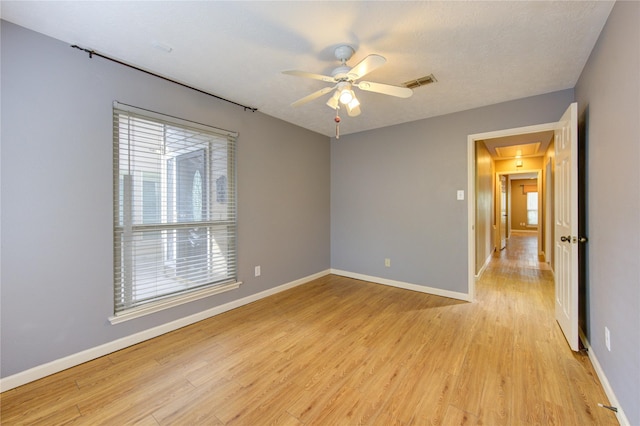 538 Everington Dr, Katy, TX 77450 - spare room with attic access, light wood-style floors, a ceiling fan, and baseboards