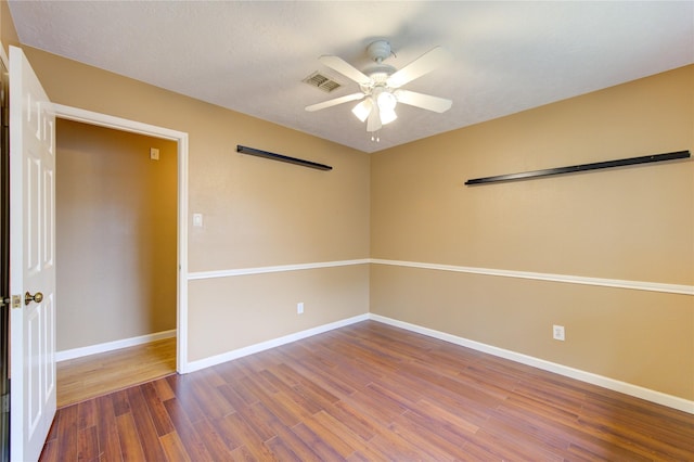 538 Everington Dr, Katy, TX 77450 - spare room with a ceiling fan, wood finished floors, and baseboards