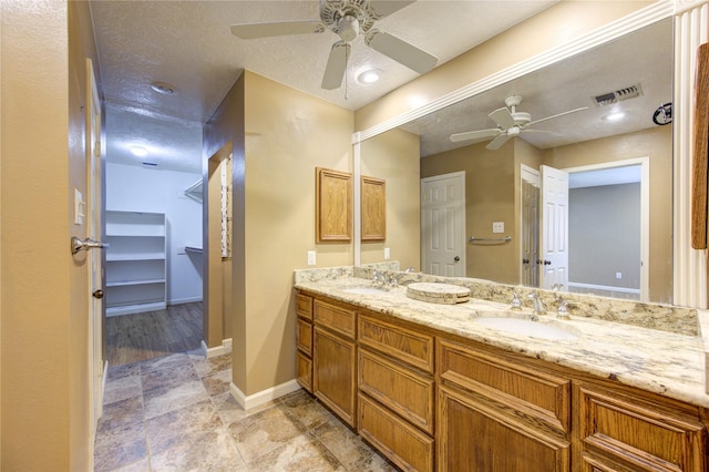 538 Everington Dr, Katy, TX 77450 - bathroom with ceiling fan, double vanity, and baseboards
