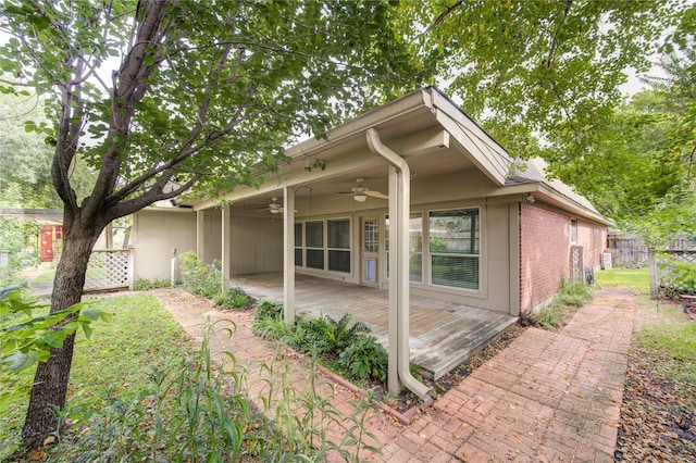538 Everington Dr, Katy, TX 77450 - view of front of property featuring a ceiling fan, brick siding, fence, and a wooden deck