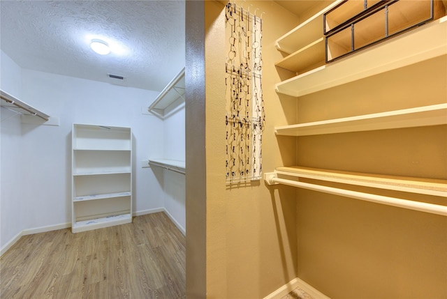 538 Everington Dr, Katy, TX 77450 - walk in closet with wood finished floors