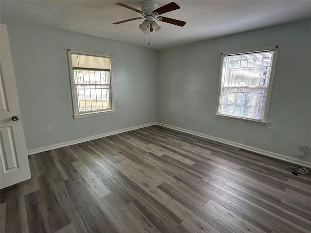 3914 Porter St, Houston, TX 77021 - unfurnished room featuring healthy amount of natural light, dark wood-type flooring, ceiling fan, and baseboards