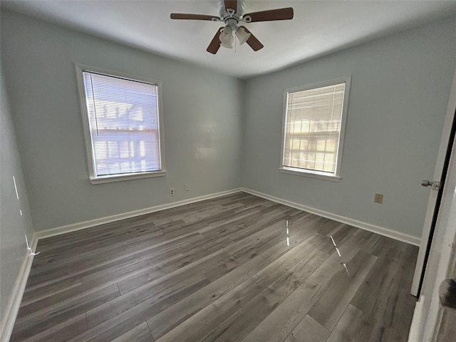 3914 Porter St, Houston, TX 77021 - empty room with plenty of natural light, dark wood-style flooring, a ceiling fan, and baseboards
