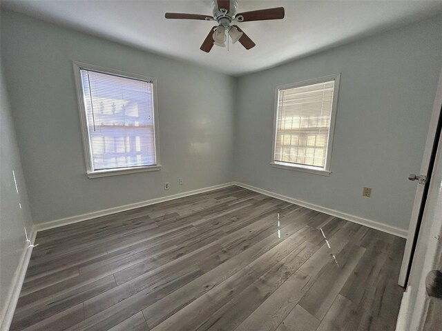 3914 Porter St, Houston, TX 77021 - empty room featuring healthy amount of natural light, dark wood-style flooring, ceiling fan, and baseboards