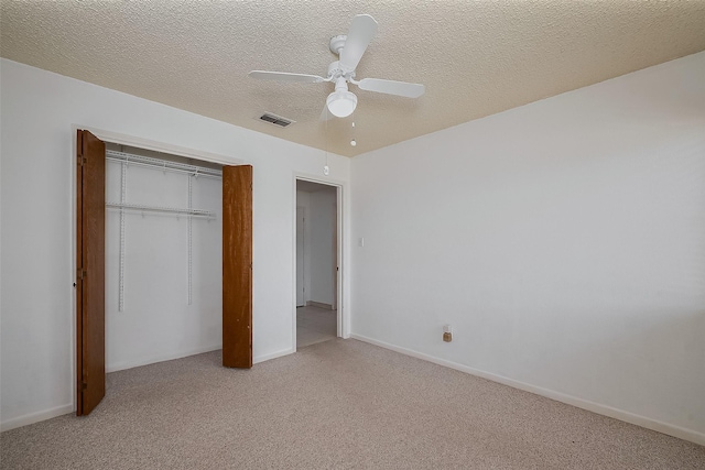 12346 Gainsborough Dr, Houston, TX 77031 - unfurnished bedroom with light colored carpet, a closet, a ceiling fan, baseboards, and a textured ceiling