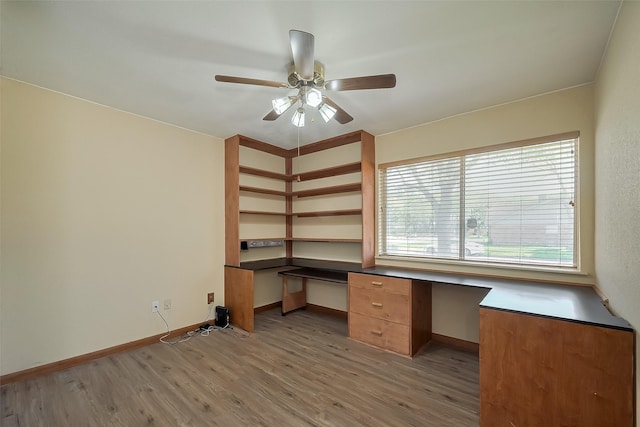 12346 Gainsborough Dr, Houston, TX 77031 - unfurnished office featuring light wood-type flooring, built in study area, baseboards, and a ceiling fan