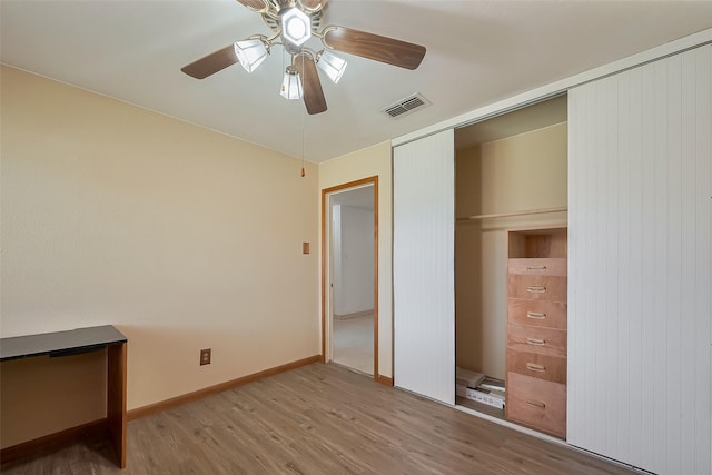 12346 Gainsborough Dr, Houston, TX 77031 - unfurnished bedroom featuring wood finished floors, a closet, ceiling fan, and baseboards