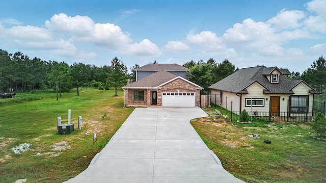 953 Rd 5606, Cleveland, TX 77327 - view of front of home with concrete driveway and an attached garage