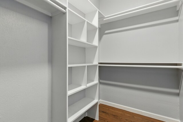 953 Rd 5606, Cleveland, TX 77327 - spacious closet with dark wood-style flooring