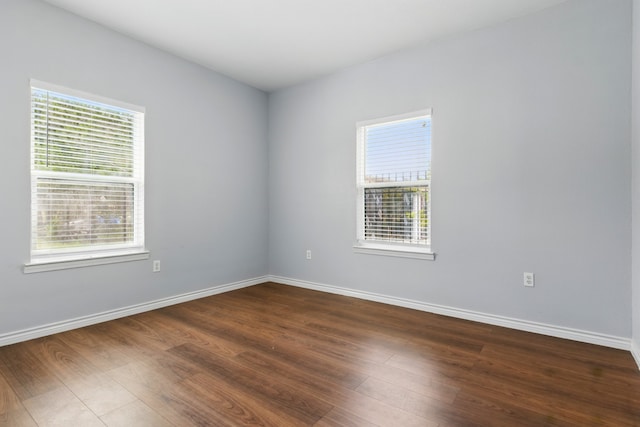 953 Rd 5606, Cleveland, TX 77327 - spare room featuring healthy amount of natural light, dark wood finished floors, and baseboards