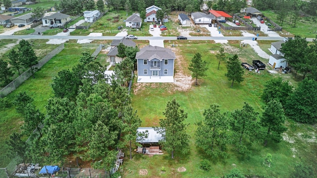 953 Rd 5606, Cleveland, TX 77327 - aerial view of property and surrounding area featuring nearby suburban area and a tree filled landscape
