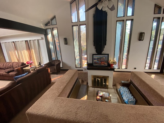 2013 Deats Rd, Dickinson, TX 77539 - tiled living area featuring high vaulted ceiling, a ceiling fan, and a fireplace with flush hearth