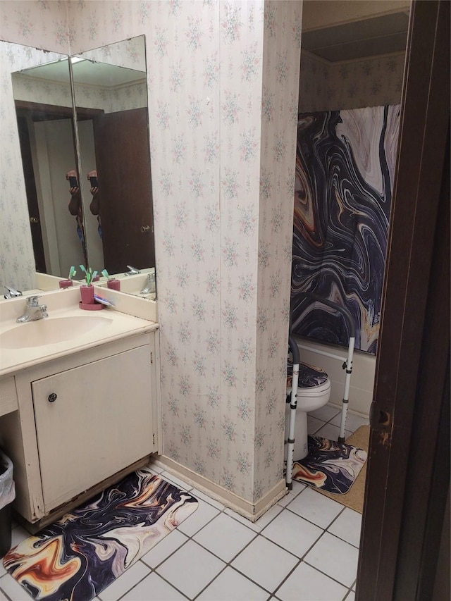 2013 Deats Rd, Dickinson, TX 77539 - bathroom featuring wallpapered walls, toilet, tile patterned floors, vanity, and baseboards