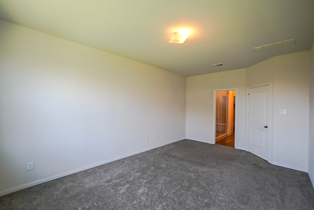 10314 White Fir Villa Ave, Houston, TX 77044 - unfurnished bedroom with dark colored carpet and baseboards
