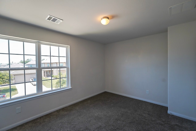10314 White Fir Villa Ave, Houston, TX 77044 - spare room featuring dark carpet and baseboards