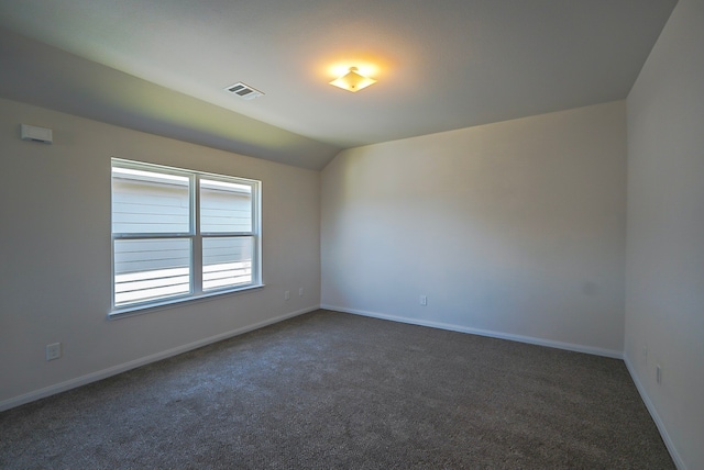 10314 White Fir Villa Ave, Houston, TX 77044 - unfurnished room with dark colored carpet, baseboards, and vaulted ceiling