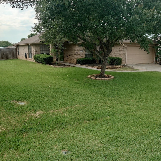 13564 Miller Ln, Willis, TX 77318 - view of yard featuring driveway and a garage