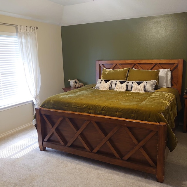 13564 Miller Ln, Willis, TX 77318 - bedroom featuring light colored carpet, baseboards, and lofted ceiling
