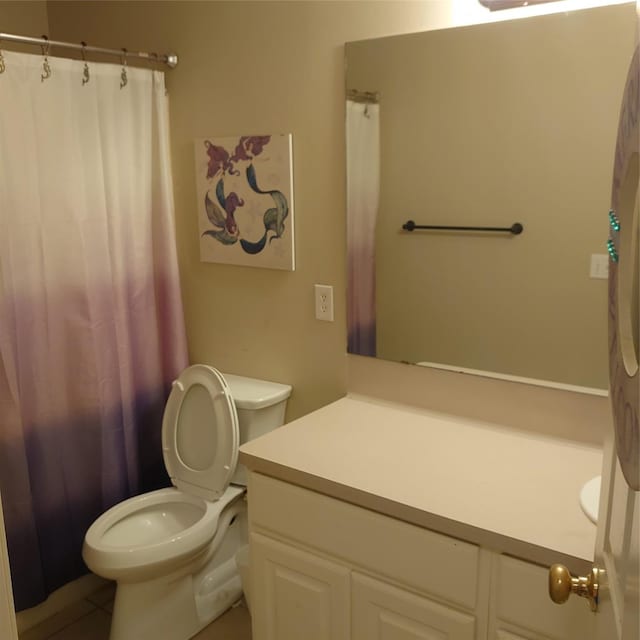 13564 Miller Ln, Willis, TX 77318 - full bathroom with vanity, toilet, and tile patterned floors