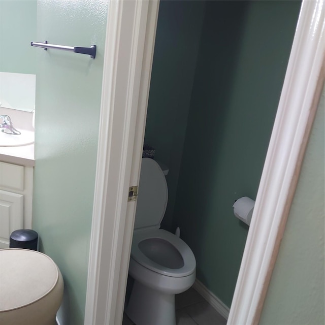 13564 Miller Ln, Willis, TX 77318 - bathroom featuring toilet, tile patterned flooring, and vanity