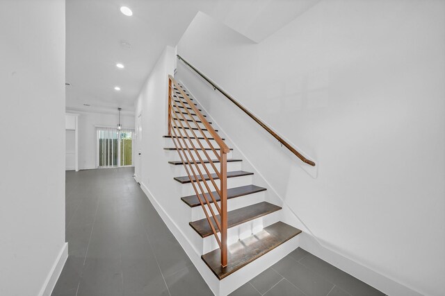 1513 Egypt St, Houston, TX 77009 - stairway with baseboards, recessed lighting, and tile patterned flooring