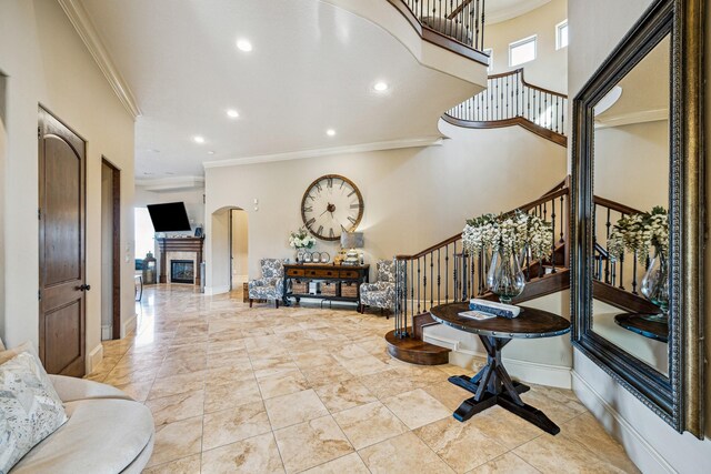 28802 Saddle Oak Dr, Conroe, TX 77356 - entryway with ornamental molding, stairs, healthy amount of natural light, recessed lighting, and arched walkways