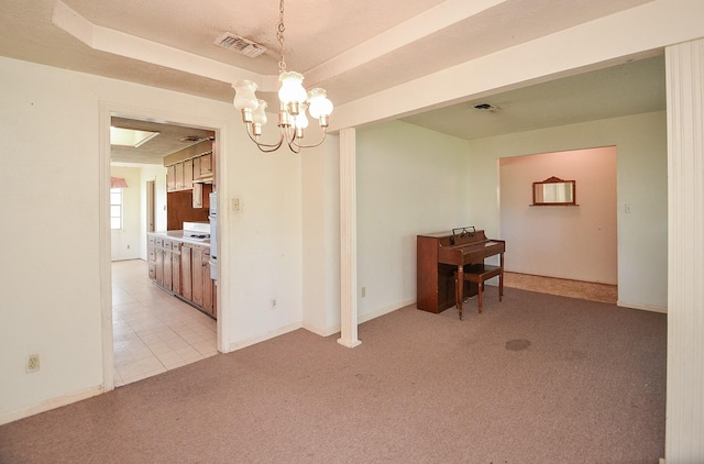 346 9th St, Hempstead, TX 77445 - unfurnished room with light colored carpet, a chandelier, and baseboards