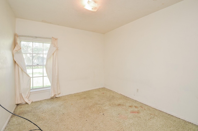 346 9th St, Hempstead, TX 77445 - spare room featuring carpet and baseboards