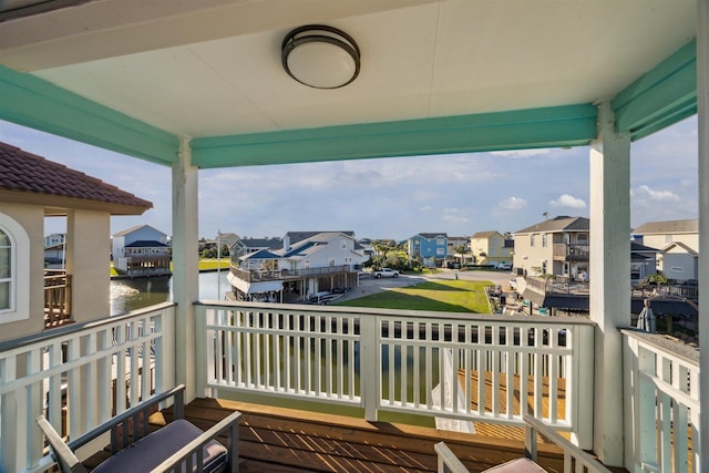 1022 Long Reach Dr, Tiki Island, TX 77554 - wooden deck with a residential view and a water view