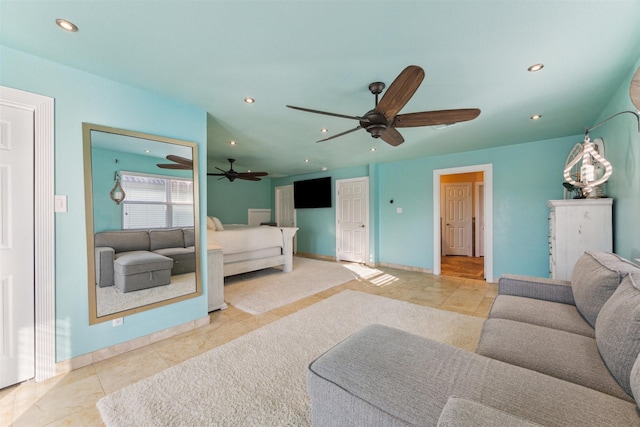 1022 Long Reach Dr, Tiki Island, TX 77554 - living area featuring ceiling fan, recessed lighting, tile patterned floors, and baseboards